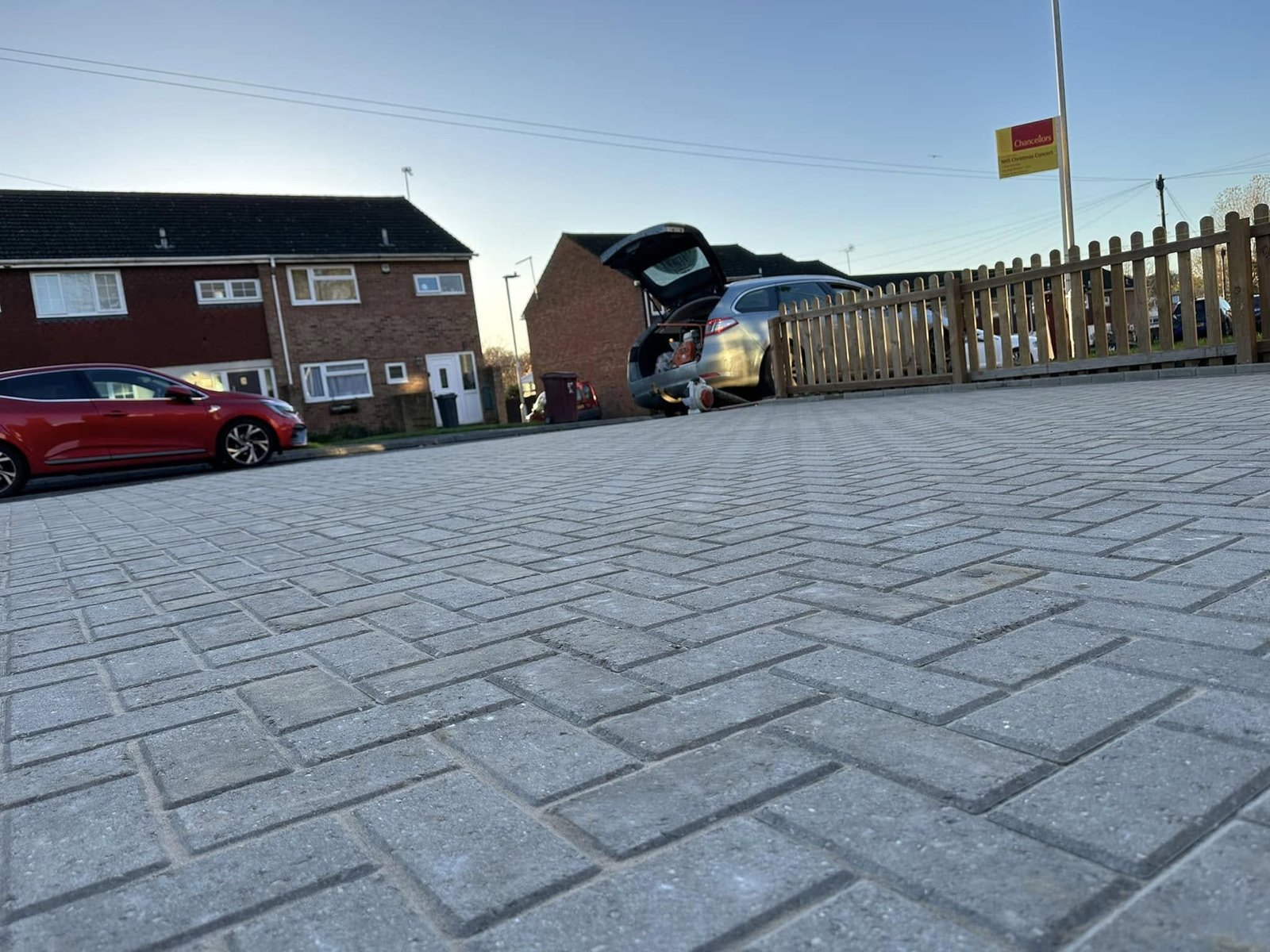 Tegula block paving with contrasting borders and close-board acoustic fencing for suburban properties in Spencers Wood and Berkshire