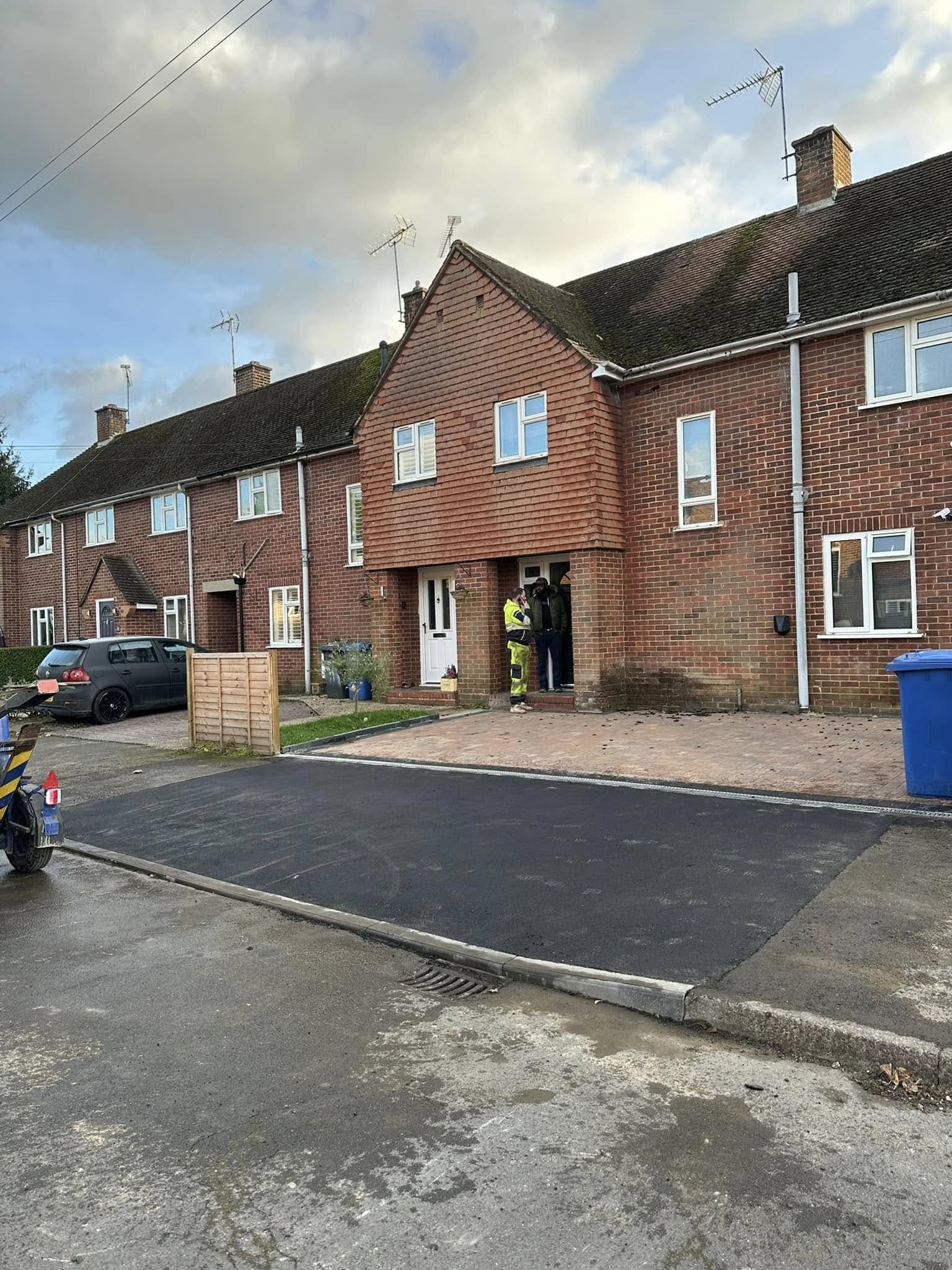 Limestone paving with curved steps and curved panel fencing for terraced gardens in Whitley and Berkshire