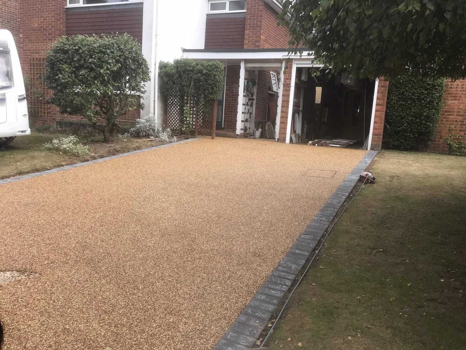 Brick weave driveway with traditional white picket gate and fencing for village cottages in Twyford and Berkshire