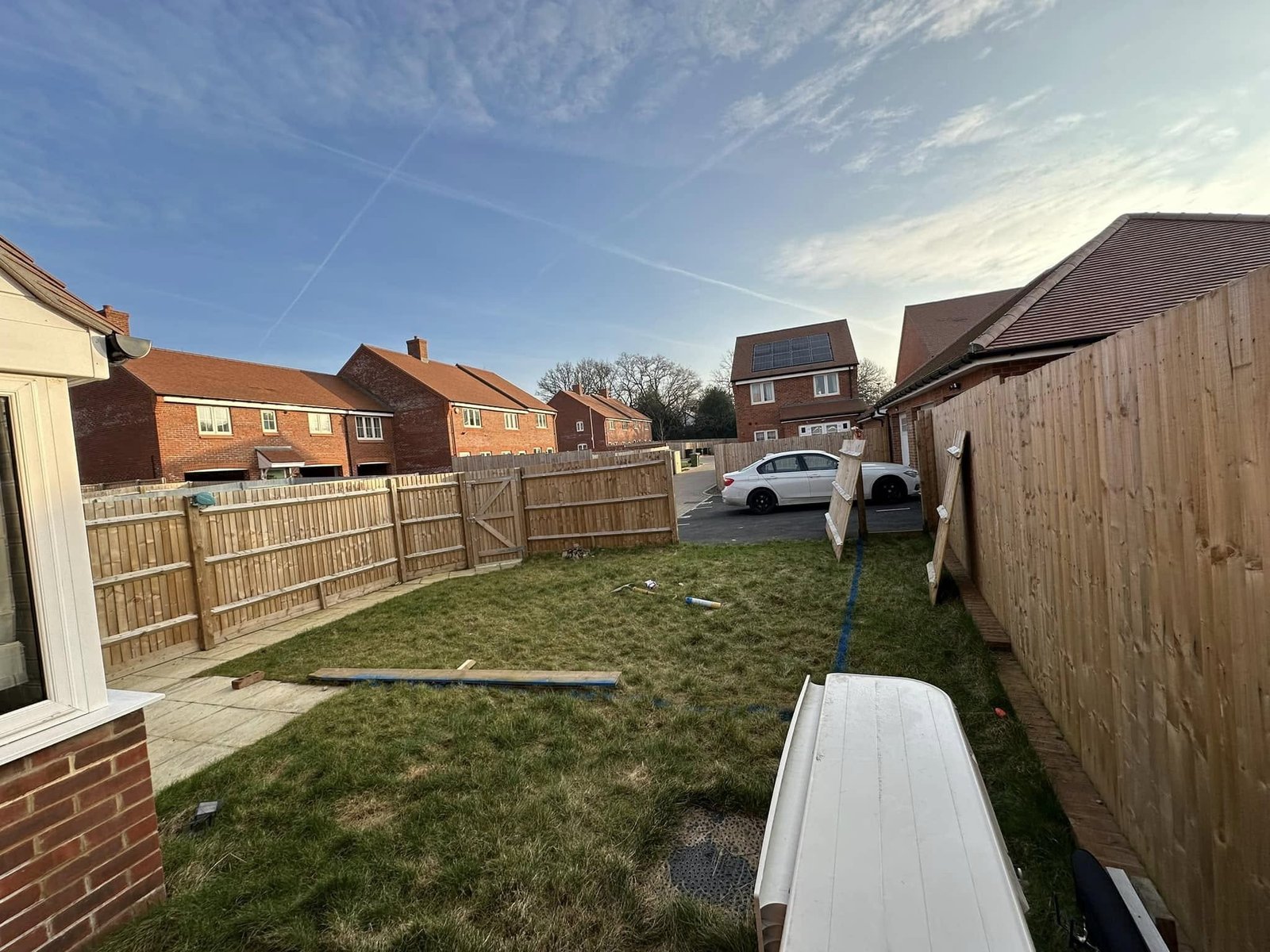 Composite decking with glass balustrade and LED lighting for contemporary extensions in Calcot and Berkshire