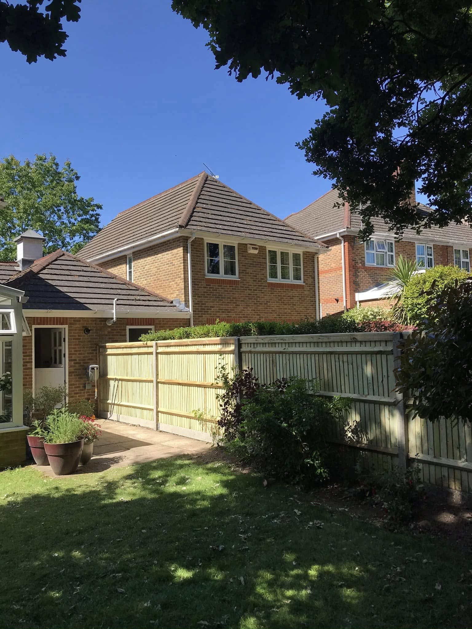 Limestone paving with granite setts and oak post-and-rail fencing for traditional gardens in Windsor and Berkshire