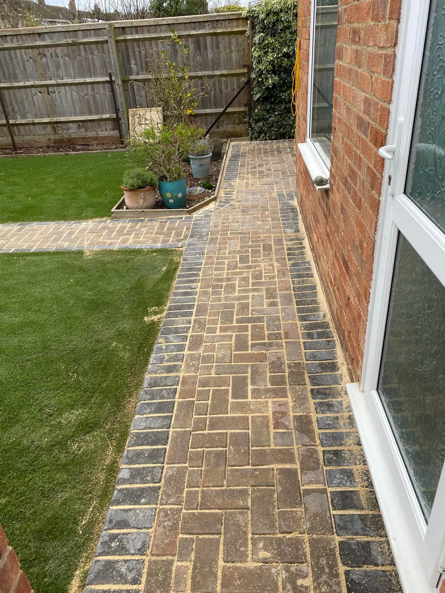 Natural stone patio design for Bracknell gardens, beautifully crafted by AJR Landscaping.