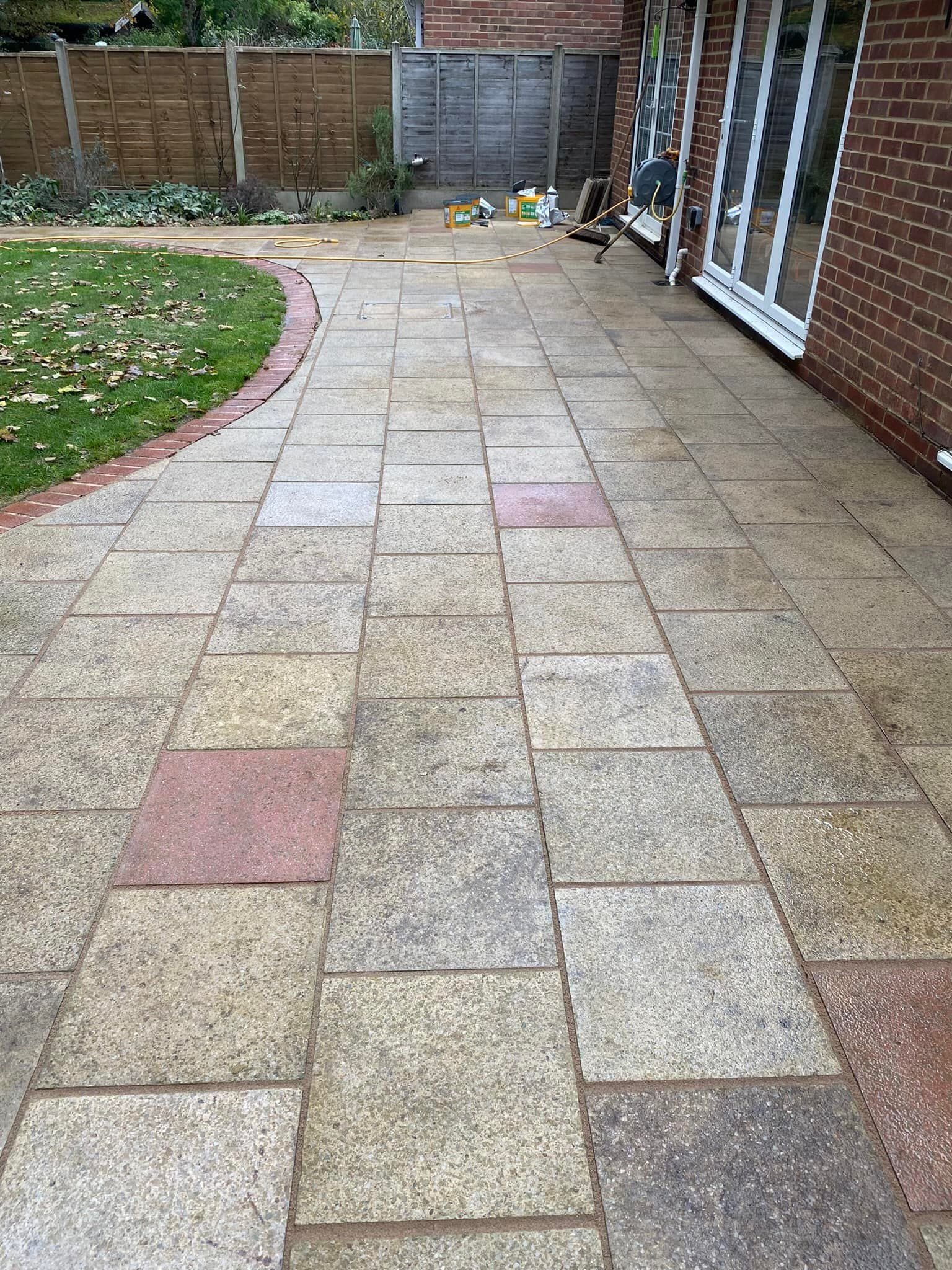 Expert patio installation with herringbone stone design for Reading and Berkshire homes