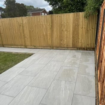 Tumbled limestone with curved borders and ornamental iron railings in an elegant Reading Victorian property, tastefully enhanced by AJR Landscaping.